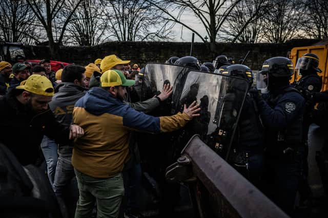 French farmers clash with riot police. Credit: Getty