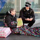 Police officer talks to homeless man in London. Credit: Nicholas.T.Ansell/PA Wire