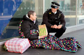 Police officer talks to homeless man in London. Credit: Nicholas.T.Ansell/PA Wire