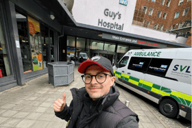 Dr Alex George giving a thumbs up in front of Guy's Hospital after being discharged. Picture: Instagram @dralexgeorge