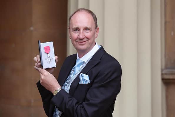 Jonathan Agnew poses after he was awarded an MBE by the Duke of Cambridgeduring an Investiture ceremony at Buckingham Palace on May 12, 2017 in London, England. The 63-year-old announced he will step down as the BBC’s cricket correspondent at the end of the summer, but will continue to commentate for Test Match Special for four more years. (Photo by Jonathan Brady - WPA Pool / Getty Images)