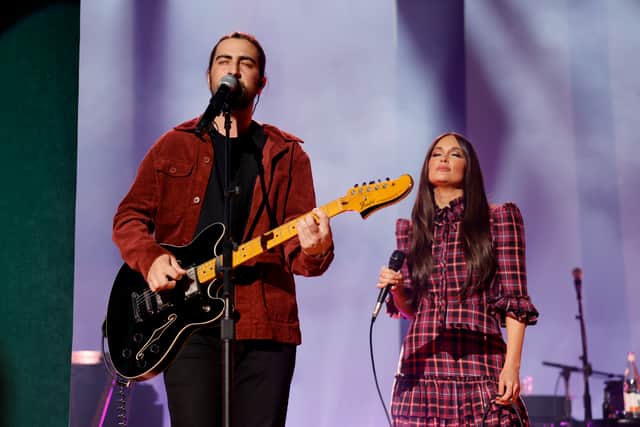 Noah Kahan and Kacey Musgraves perform onstage for her album release show of Deep Into The Well at Ryman Auditorium on March 15, 2024 in Nashville, Tennessee. (Photo by Jason Kempin/Getty Images for ABA)