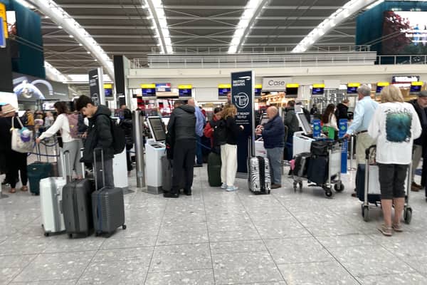 Passengers wait in line at Terminal 5 of Heathrow Airport, London. A planned relaxation of rules around airline passengers carrying liquids in hand luggage has been delayed by a year Picture: Jordan Pettitt/PA Wire