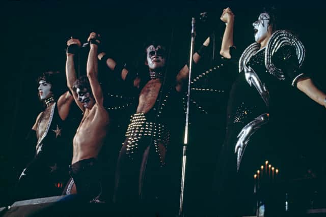 American rock group Kiss take a curtain call after a performance, circa 1977. Left to right; guitarist Paul Stanley, drummer Peter Criss, bassist Gene Simmons and guitarist Ace Frehley. (Photo by Michael Putland/Getty Images)