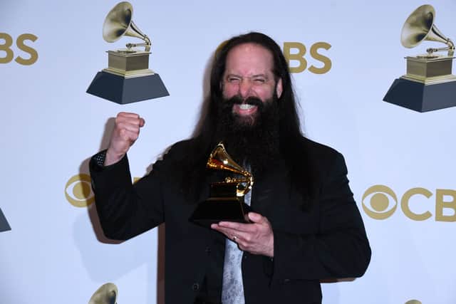 John Petrucci of "Dream Theater" poses in the press room with award for Best Metal Performance for "The Alien" during the 64th Annual GRAMMY Awards at MGM Grand Garden Arena on April 03, 2022 in Las Vegas, Nevada. (Photo by Mindy Small/Getty Images)