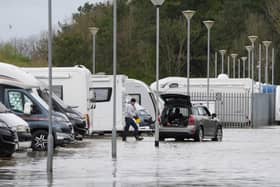 One person was hospitalised amid flooding at a holiday park in West Sussex after River Arun burst its banks in the midst of high winds and heavy rain. (Credit: Gareth Fuller/PA Wire )