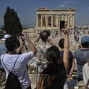 UK holidaymakers have been issued a Greece holiday warning as there have been furious protests in popular tourist city Athens declaring “no more tourism”. Picture: AFP via Getty Images