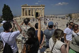 UK holidaymakers have been issued a Greece holiday warning as there have been furious protests in popular tourist city Athens declaring “no more tourism”. Picture: AFP via Getty Images