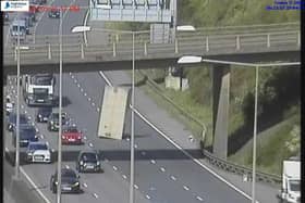 Traffic stopped on the M25 after the top of a van landed on the carriageway