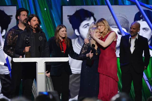 (L-R) Krist Novoselic, Dave Grohl, Kimberly Cobain, Wendy O'Connor, Courtney Love and Michael Stipe pose onstage at the 29th Annual Rock And Roll Hall Of Fame Induction Ceremony at Barclays Center of Brooklyn on April 10, 2014 in New York City.  (Photo by Larry Busacca/Getty Images)