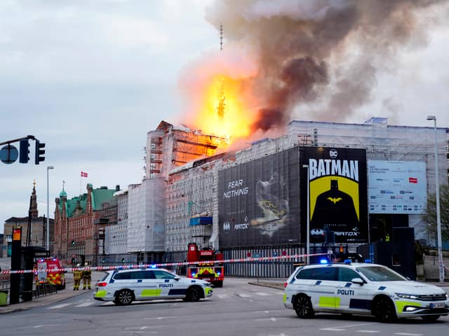 A huge fire engulfed Copenhagen's famous Old Stock Exchange, the spire of which would rise above the city skyline. (Credit: Ritzau Scanpix/AFP via Getty Images)
