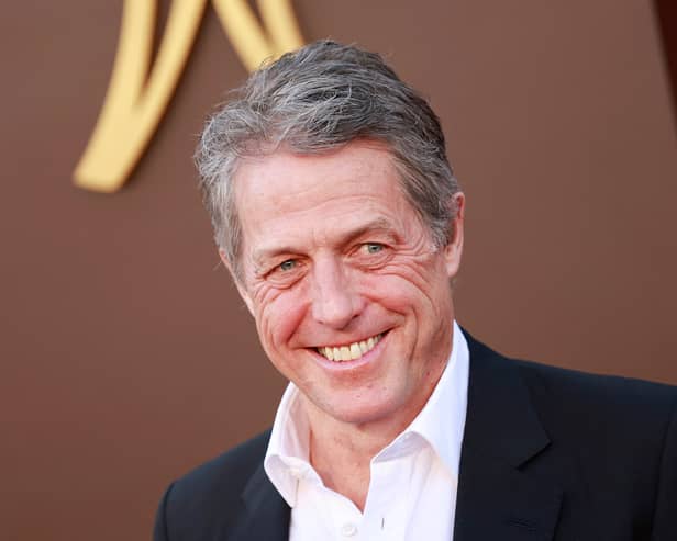 Hugh Grant has settled his lawsuit with The Sun's publisher after he alleged unlawful information gathering practices. (Credit: Getty Images)