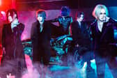 The GazzettE bassist Reita (rear centre on the car) has died at the age of 42, his bandmates confirmed on social media (Credit: Hirano Takashi)