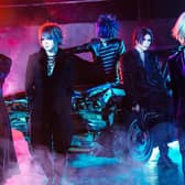The GazzettE bassist Reita (rear centre on the car) has died at the age of 42, his bandmates confirmed on social media (Credit: Hirano Takashi)