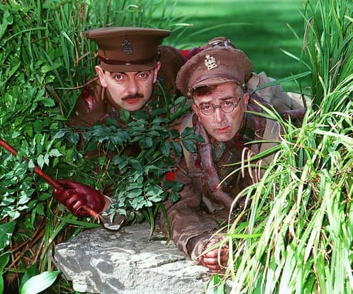 Rowan Atkinson as Captain Blackadder, left, and Tony Robinson as Private Baldrick 
