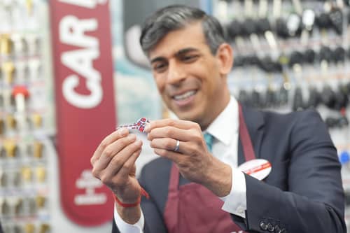 Prime Minister Rishi Sunak looks at a key after operating a cylinder key machine to copy and cut a cylinder key during a visit to a branch of Timpson, in central London after he gave a major policy speech on welfare reform where he called for an end to the "sick note culture". Credit: PA