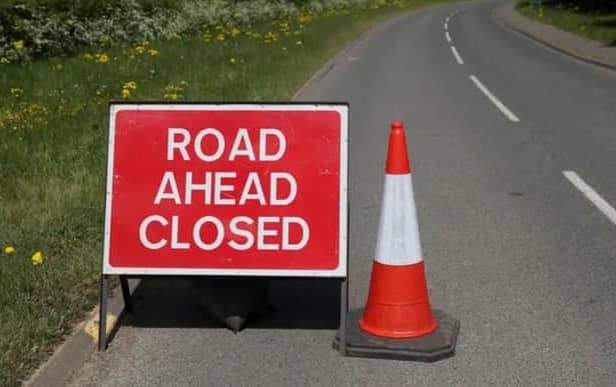 A road has been closed after a vehicle overturned in Derby. 