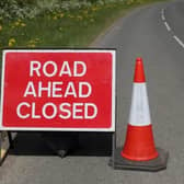 A road has been closed after a vehicle overturned in Derby. 
