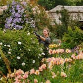 Willow Silvani tends plants in the Pottager and Cottage gardens at RHS Garden Rosemoor in Devon - the Royal Horticultural Society gardens are 98% peat-free. Picture: PA