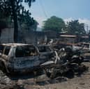 The charred remains of vehicles that were burned near a garage in Port-au-Prince, Haiti, earlier this year Picture: Clarens Siffroy / AFP via Getty Images