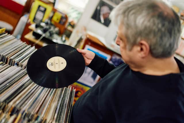 A customer browses for vinyls at indie record store Flashback Records in London on April 18, 2024. Record Store Day is celebrated across the UK on April 20 when independent record shops celebrate their culture by selling special vinyl releases. (Photo by BENJAMIN CREMEL / AFP) (Photo by BENJAMIN CREMEL/AFP via Getty Images)