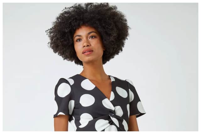 Although black was considered not the right colour for wedding guest outfits years ago, times have changed, and I just love this Black Polka Dot Premium Stretch Midi Twist Dress, £52, from Roman