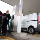 A motorist refuels their car at a petrol station (Photo: ADRIAN DENNIS/AFP via Getty Images)