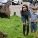 Prince Louis turns six: Royal fans anticipating celebratory photographs are so far disappointed. Britain's Catherine, Princess of Wales (L) and Britain's Prince Louis of Wales (R) watch Britain's Prince William, Prince of Wales (not pictured) as he uses an excavator while taking part in the Big Help Out, during a visit to the 3rd Upton Scouts Hut in Slough, west of London on May 8, 2023, where the family joined volunteers helping to renovate and improve the building