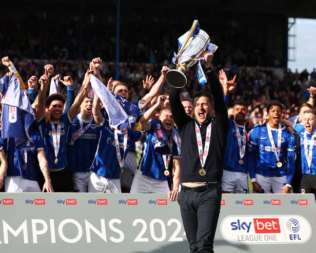Portsmouth have ended a 12-year wait by winning promotion to the Championship.