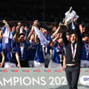 Portsmouth have ended a 12-year wait by winning promotion to the Championship.