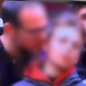 Police investigate after snooker coverage at The Crucible appears to show man 'biting' a child's ear. Picture: The Standard