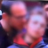 Police investigate after snooker coverage at The Crucible appears to show man 'biting' a child's ear. Picture: The Standard
