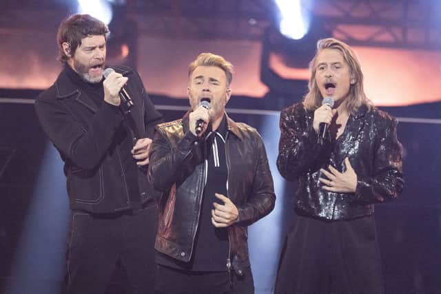 Howard Donald, Gary Barlow and Mark Owen of Take That perform on stage during the "Wetten, Dass ...?" tv show on November 25, 2023 in Offenburg, Germany.  (Photo by Andreas Rentz/Getty Images)