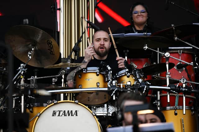 Sepultura's Brazilian drummer Eloy Casagrande performs during the concert with the Brazilian Simphony Orchestra at the Main Stage of the Rock in Rio music festival at the Olympic Park in Rio de Janeiro, Brazil, on September 2, 2022