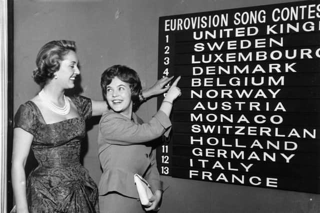 Eurovision Song Contest compere Katie Boyle (on the left) checks the scoreboard for the order of the draw with Katy Bodtger of Denmark.   (Photo by Keystone/Getty Images)