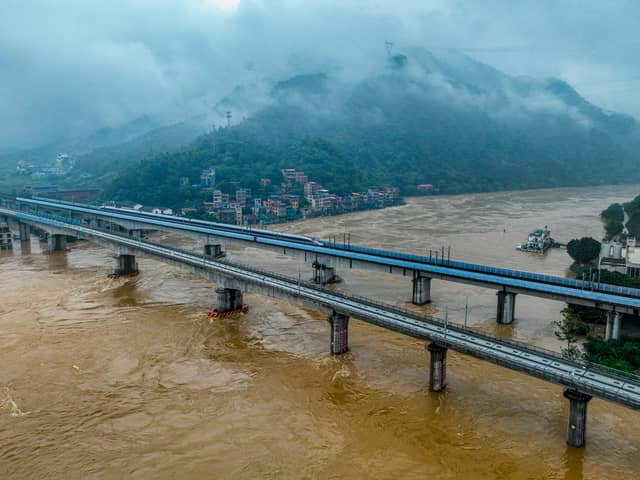 A highway in China has collapsed, killing 19 people, after its most populous province experienced its heaviest rainfall since records began. (Credit: AFP via Getty Images)
