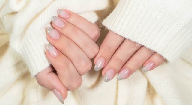Glitter french manicure. Photo by Adobe Photos.