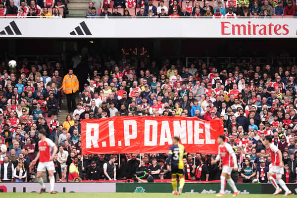 Fans hold up a banner in memory of 14-year-old Arsenal fan Daniel Anjorin, who died following the sword attack in east London this week (Photo: Adam Davy/PA Wire)