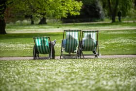 People make use of deckchairs during the warm weather at St James's Park in Central London, in mid-April. (Photo: Jeff Moore/PA Wire)