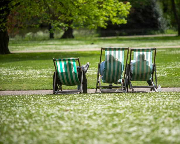 People make use of deckchairs during the warm weather at St James's Park in Central London, in mid-April. (Photo: Jeff Moore/PA Wire)