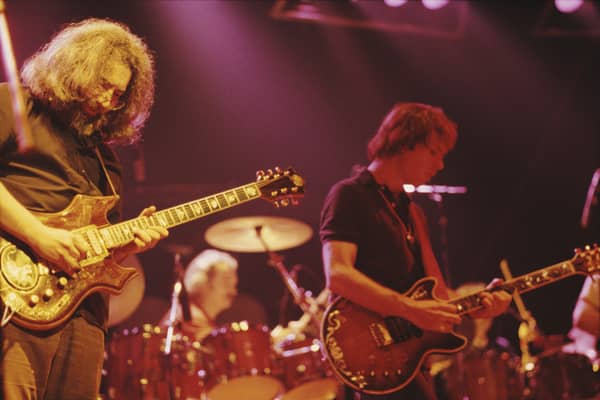 Jerry Garcia (left) and Bob Weir of American rock band The Grateful Dead performing at the Wembley Empire Pool in London on 7th April 1972. Over 300 items of Grateful Dead memorabilia are set to go to auction through ANALOGr from May 15 2024 (Credit: Michael Putland/Getty Images)