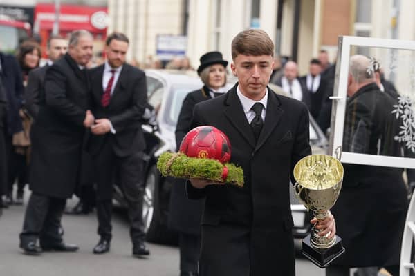 A football being carried carried into St Mary And St Eanswythe Church, Folkestone ahead of the funeral of William Brown. Picture: Gareth Fuller/PA Wire