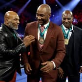 Lennox Lewis (C) could follow in footsteps of Mike Tyson (L) and Evander Holyfield (R)