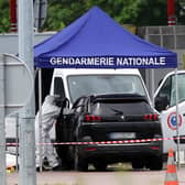 A forensic investigation at the site of a ram attack which took place late morning at a road toll in Incarville in the Eure region of northern France, on May 14, 2024. Two French prison officers were killed and two others wounded on May 14 in an attack on a prison van transporting an inmate who escaped, a police source told AFP. (Photo by ALAIN JOCARD / AFP) (Photo by ALAIN JOCARD/AFP via Getty Images)