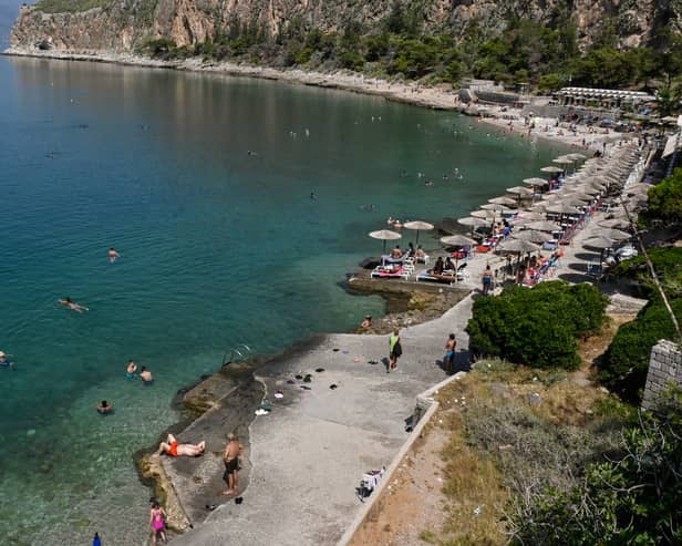 Anti-tourist graffiti telling holidaymakers to “go home” has emerged in popular holiday hotspot Athens in Greece following other European destinations. (Photo: AFP via Getty Images)