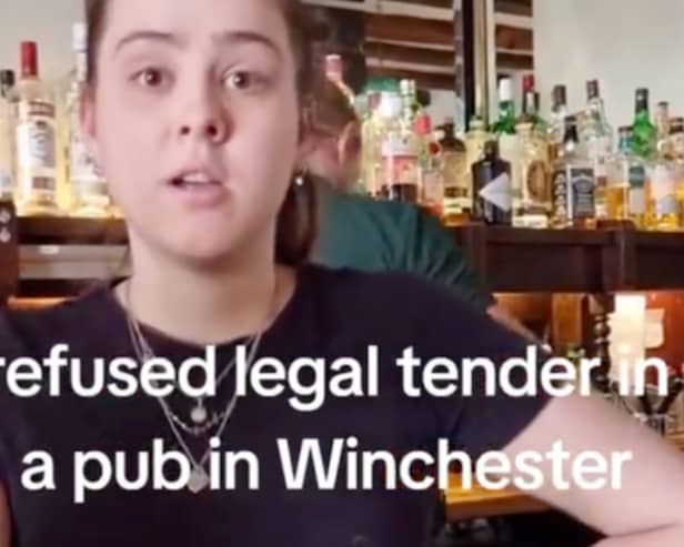 The assistant manager behind the bar is told she 'must' accept cash as it is 'legal tender' - this is not true (Photo: TikTok)