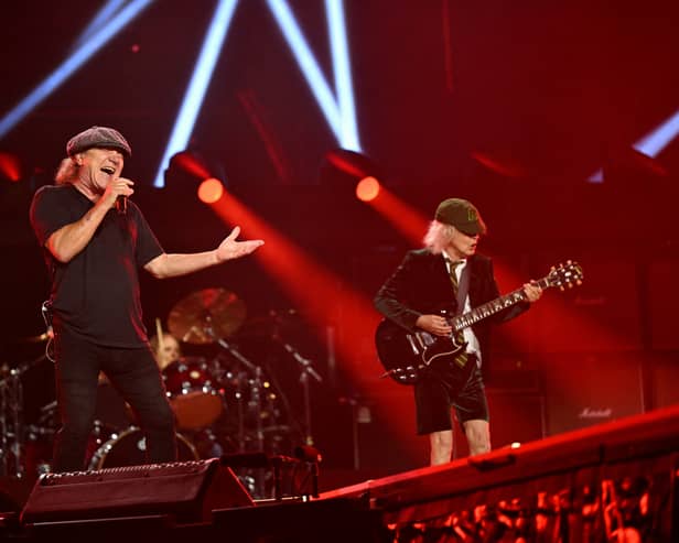 [L-R] Brian Johnson and Angus Young of AC/DC on stage in Germany as part of their "PWR UP" tour. The band are set to perform at Wembley in July - but are there tickets still available? (Credit: Getty Images)