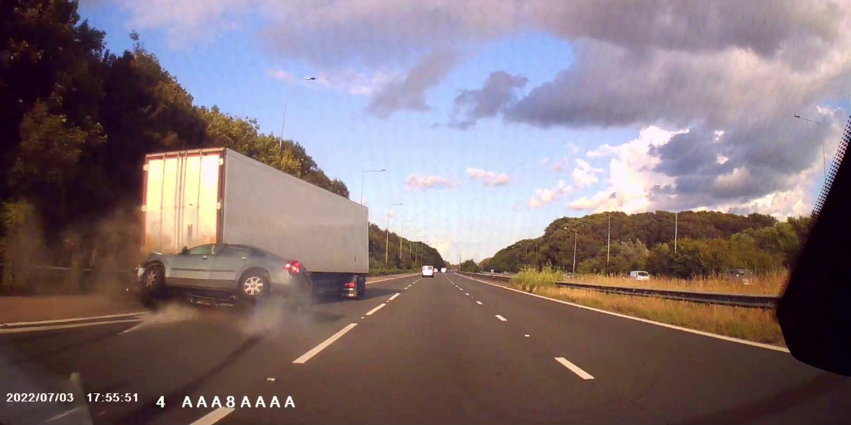 Watch: Speeding driver smashes into back of lorry before flipping over