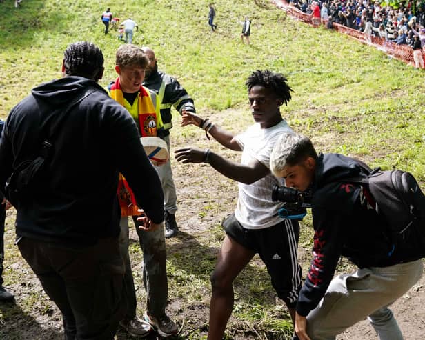 American YouTuber and rapper, Darren Watkins Jr, known online as IShowSpeed or Speed, was hospitalised after taking part in the famous cheese-rolling race in Gloucestershire. (Credit: Jacob King/PA Wire)