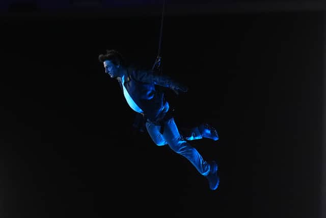 Tom Cruise enters the stadium during his stunt
